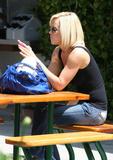 Actress Jenny McCarthy braless in black top shopping at 98% Angel in Malibu